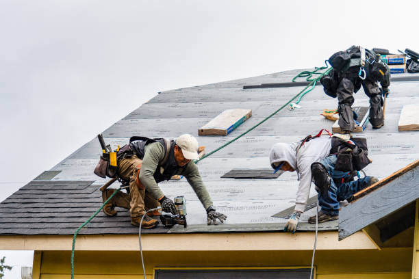 Professional Gutter Installation technician working in Boxborough, MA